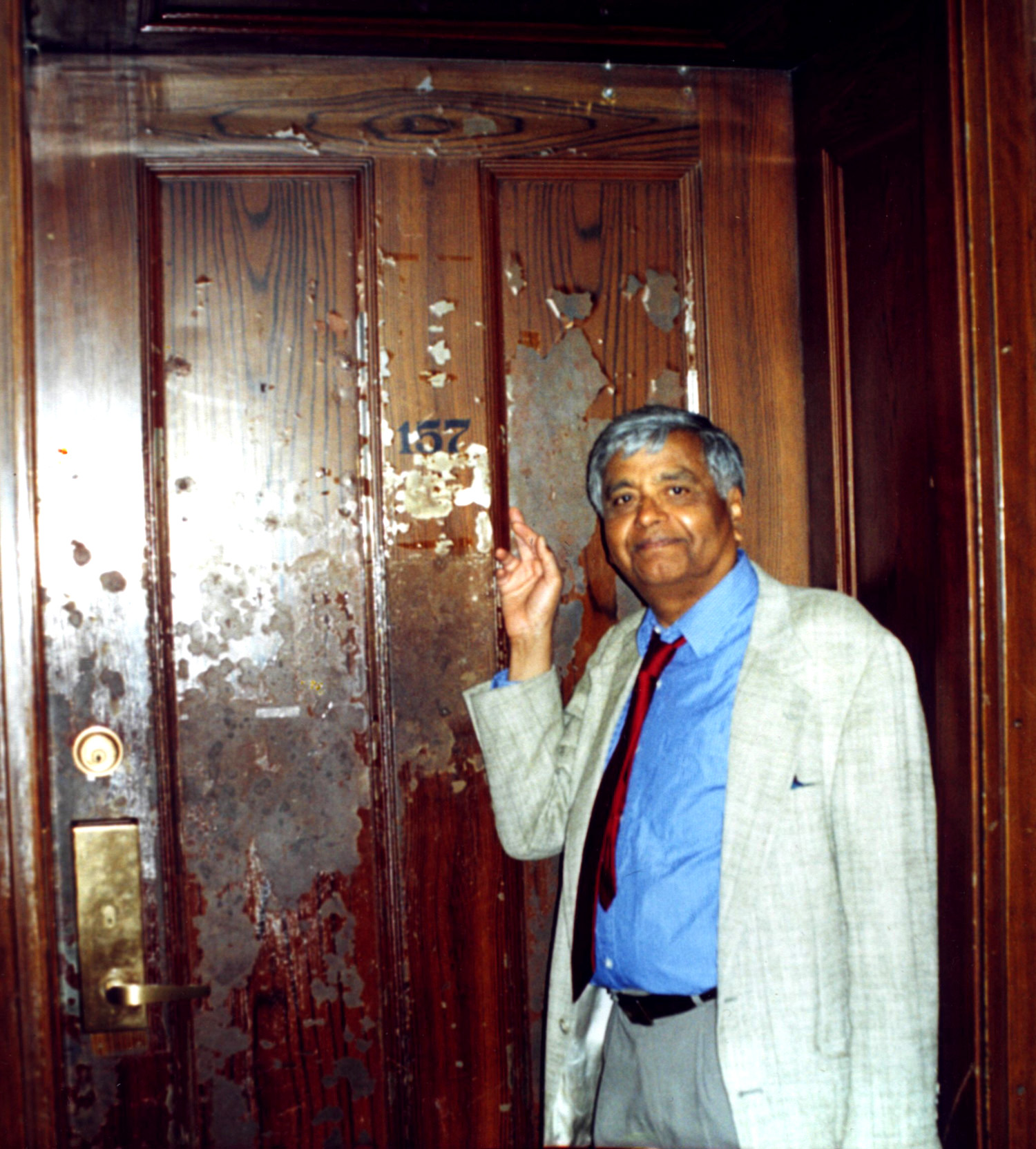 Govindjee standing outside old office door